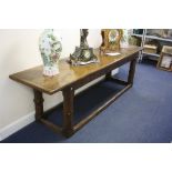 AN OAK REFECTORY TABLE, constructed from earlier timbers with two plank top over carved rail with