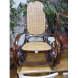 A BENTWOOD ROCKING CHAIR