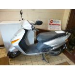 A HONDA MOPED, model SCU 100 F-S 102cc, petrol, silver paint work, Reg No BG57 AEE, current recorded