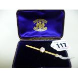 A BAR BROOCH, with singular pale pink circular cut gemstone within a fitted box, length 6.5cm,