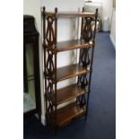 A MODERN MAHOGANY FIVE TIER OPEN BOOKCASE, with lyre detail to side supports and two small lower