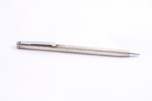 A CARTIER STERLING SILVER PROPELLING BALLPOINT PEN, stamped Cartier Sterling Silver at barrel joint