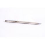 A CARTIER STERLING SILVER PROPELLING BALLPOINT PEN, stamped Cartier Sterling Silver at barrel joint