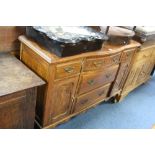 AN EDWARDIAN CARVED WALNUT SIDEBOARD