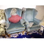TWO UPHOLSTERED WING BACK ARMCHAIRS