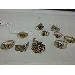 A COLLECTION OF JEWELLERY, to include eight rings, a pendant, together with a pair of mother of
