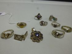 A COLLECTION OF JEWELLERY, to include eight rings, a pendant, together with a pair of mother of