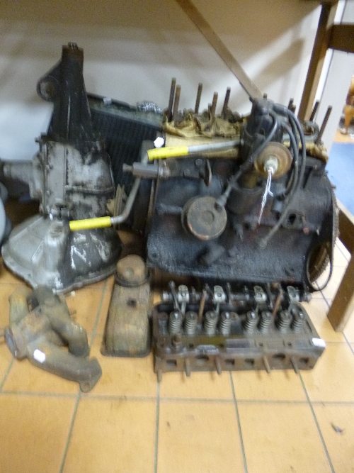 A VINTAGE STANDARD ENGINE, (half stripped), gearbox, radiator and exhaust parts
