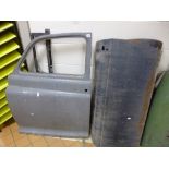 A ROVER 110 NEARSIDE FRONT DOOR, two door skins and a frame (4)