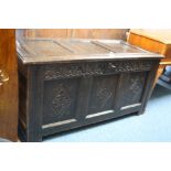 A GEORGIAN CARVED OAK TRIPLE PANEL BLANKET CHEST (key)