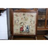 A 19TH CENTURY SAMPLER FIRESCREEN, 'Joseph, Mary and Jesus 1847' by Mary Buckley (sd)