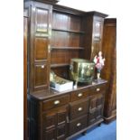 A VICTORIAN STAINED DRESSER, the breakfront top section with side cupboards above five drawers and