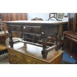 AN OAK COFFEE TABLE, with two drawers and stretcher base