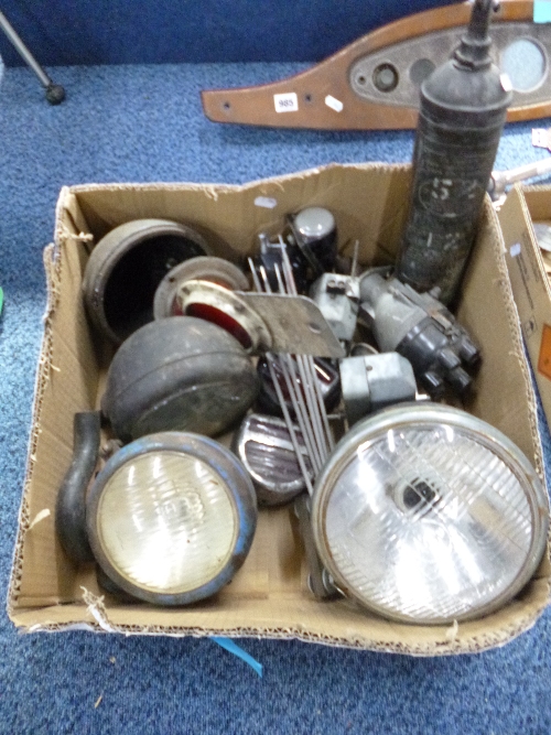 A BOX CONTAINING VARIOUS LUCAS CAR PARTS, including headlamps etc and a Pyrene vintage fire