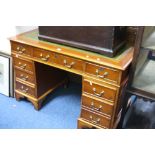 A MODERN YEW WOOD KNEE HOLE DESK, with eight drawers and green tooled leather inlay top, approximate