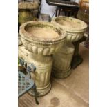 A PAIR OF COMPOSITE COMPAGNA STYLE GARDEN URNS, on separate pillar bases, approximate size height