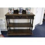 A VICTORIAN CARVED OAK THREE TIER SIDE BUFFET, wqith lions mask detail and two upper drawers,