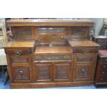 AN EDWARDIAN CARVED WALNUIT SIDEBOARD, with raised back, approximate size width 182cm x depth 60cm x