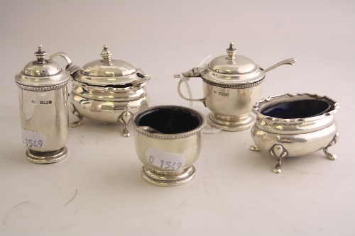 A MATCHED SILVER THREE PIECE CRUET, of cylindrical form with beaded rim on circular foot,