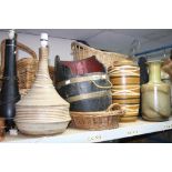 A BARREL SHAPED LOG BOX, various vases and lamp bases, a quantity of wicker baskets etc