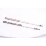 A STERLING SILVER PROPELLING PENCIL RULE, which extends from 31/2' to 12' on square graduated