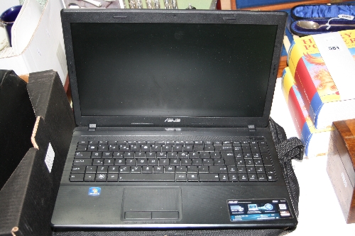 AN ASUS LAPTOP, X54H, with instructions, power cable and hold-all