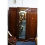 A VICTORIAN MAHOGANY BREAKFRONT WARDROBE, with central mirrored door, approximate size width 168cm x