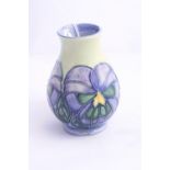 A SMALL MOORCROFT POTTERY VASE, stylised flower design, impressed mark and painted 'MW', height