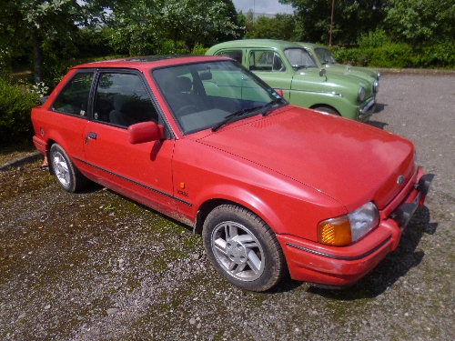 A FORD ESCORT XR3I, 1600cc, petrol, red paint work, three door hatchback, Reg No F943 CRJ, current