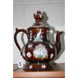 A LARGE MEASHAM BARGEWARE TEAPOT, COVER AND STAND, treacle glazed with details of birds and