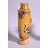 A FRENCH OPAQUE CYLINDRICAL TWIN HANDLED GLASS VASE, with hand painted Herons and branches with