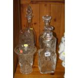 FOUR CUT/CLEAR GLASS DECANTERS, and two cut glass vases (6)