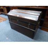 A DOME TOP METAL BANDED TRAVELLING TRUNK, with carrying handles