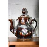 A LARGE MEASHAM TEAPOT AND COVER, treacle glazed with applied bird, foliage and plaque 'A Present to