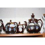 THREE MEASHAM BARGEWARE TEAPOTS, to include a large teapot (damaged/restored), height