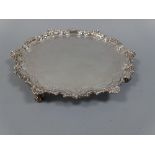 A SILVER SALVER, of shaped circular form with beaded rim with scroll and shell decoration,