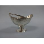 A SILVER SUGAR BASKET, of urn shape with engraved swag band to shaped rim on oval foot with matching
