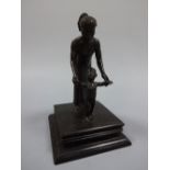 A BURMESE CAST BRONZED FIGURE GROUP, depicting mother helping young child to balance walking, square