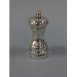 A SILVER CAPSTAN PEPPER MILL, London 1987, approximately 11cm high