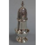 A SILVER SUGAR CASTER, of baluster form, pierced diamond shape engraved top section with urn finial,