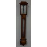 A 19TH CENTURY OAK STICK BAROMETER, with chamfered edges, demi lune cistern cover, architectural