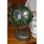 A CLOISONNE PLATE, on wooden stand, diameter approximately 11.5cm, together with white metal pierced