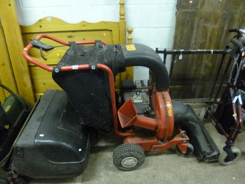 A MTD PETROL GARDEN SHREDDER/VAC, on wheels