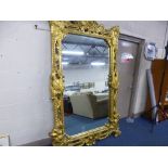 A LARGE MODERN GILT FRAMED WALL/DRESSING MIRROR, (sd, repairs), approximate size width 152cm x