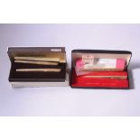 A BOXED ROLLED GOLD PARKER 61 FOUNTAIN PEN AND PROPELLING PENCIL SET, and two rolled gold Parker