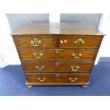 A GEORGIAN OAK CHEST, of two short and three long drawers on later turned supports (repairs,
