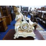 A DECORATIVE CERAMIC CLOCK, with scantily clad female with swan detail (battery operated)