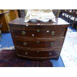 A 19TH CENTURY MAHOGANY AND SATINWOOD CROSSBANDED BOW FRONTED CHEST, of three long graduating