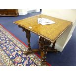 AN OAK OCCASIONAL TABLE, with parquetry inlaid top, the base with five carved and turned supports,