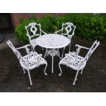 A PAINTED CIRCULAR ALUMINIUM GARDEN TABLE, and four chairs (5)